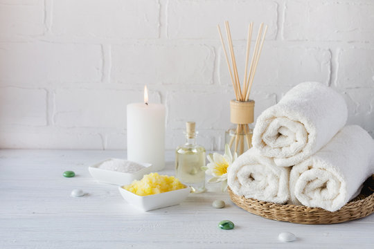 Spa Still Life With Towel,white Lily, Sea Salt, Bath Oil, Sugar Body Scrub And Candle