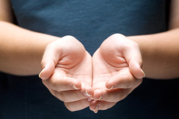 Open palms of a young woman
