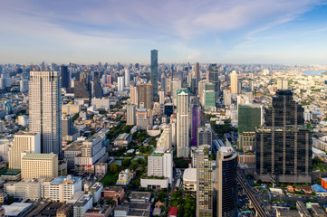 Fototapeta na wymiar Aerial view of Bangkok modern office buildings, condominium in Bangkok city downtown with sunset sky ,Bangkok is the most populated city in Southeast Asia. Bangkok , Thailand