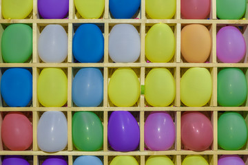 Bright colored lamps on carousels at night.