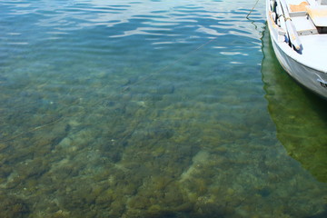 Obraz premium The clear water of the Mediterranean Sea ner Tassos Island and a boat