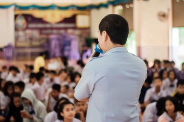 Guy speaks microphones at the meeting.