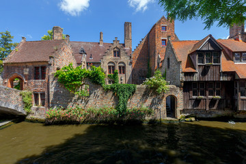 Naklejka premium Brugge. Medieval houses over the canal.