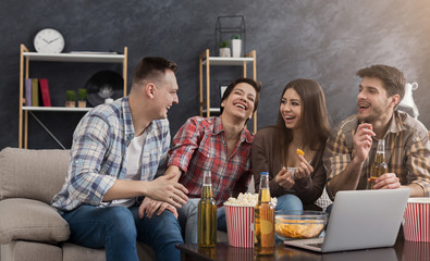 Happy friends watching comedy movie