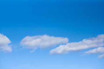 Fototapeta premium White clouds against a blue sky