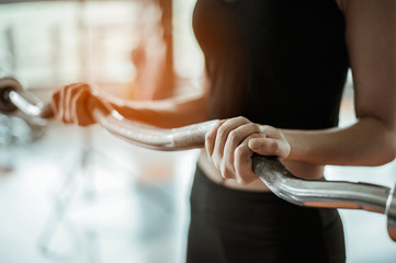 young fitness asian woman exercise with  barbells in gym for building muscles.exercising concept.fitness and healthy lifestyle