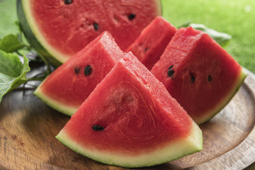 Fresh sliced watermelon wooden background