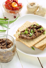 Mushroom pate and dried tomatoes with crackers, mousse, vertical 