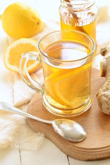 Lemon ginger drink with honey, tea, vertical 