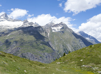 Distant steep rocky snow-capped alpine summit in Valais - Swiss Alps
