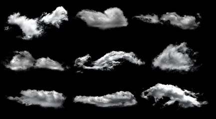Set of white clouds over black