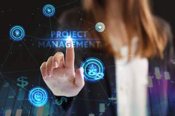 The concept of business, technology, the Internet and the network. A young entrepreneur working on a virtual screen of the future and sees the inscription: Project management