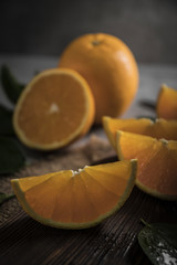 Beautiful, fresh orange on the dark background. Healthy sweet food concept.