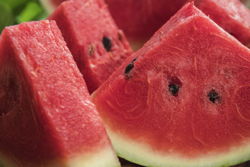 Fresh sliced watermelon wooden background