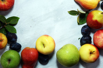 Various fresh fruits. Thanksgiving apples, and pears on rustic background.
