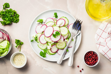 Summer vegetarian radish, cucumber feta salad. Top view, space for text.