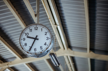 Fototapeta na wymiar clock in the train station on background.