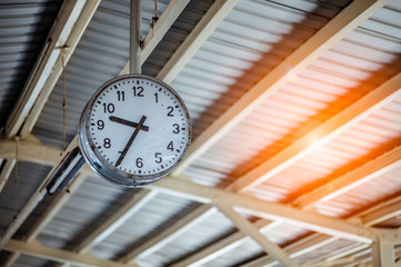 clock in the train station on background.