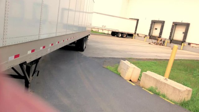 Backing trailer to dock door view from inside the truck