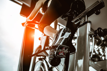 Fitness woman working out on exercise bike at the gym.exercising concept.fitness and healthy...