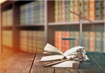 Justice Scales and books on desk