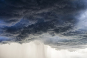 Obraz premium Light in the Dark and Dramatic Storm Clouds background