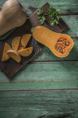 butternut squash over old wood background