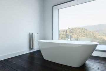 Minimalist bathroom with tub and towel holder