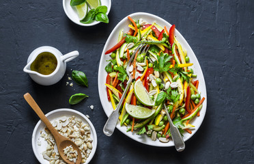 Raw vegetables Pad Thai salad on dark background, top view. Vegetarian healthy food