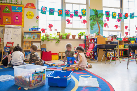 Students working in a kindergarten classroom. 