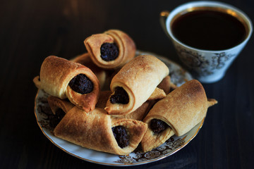 Coffee with poppy-bagels. Selective focus. Copy space.
