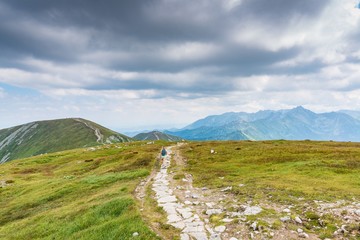 Woman walking on mountain trail