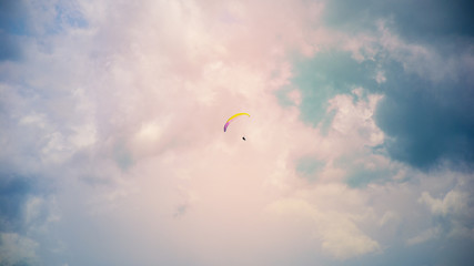Extreme sport. Paraglider on the sky background