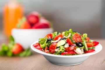 Photo of fresh salad with vegetables