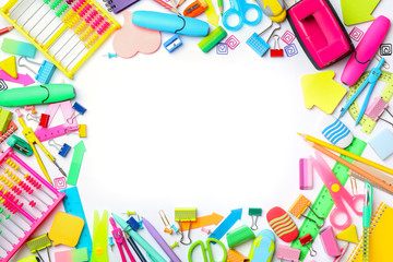 Frame made of different school stationery on white background