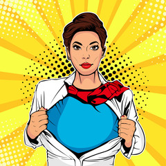 Pop art female superhero. Young sexy woman dressed in white jacket shows superhero t-shirt. Vector illustration in retro pop art comic style. © Brazhyk