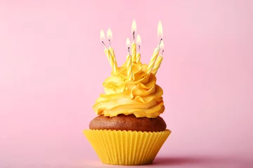  Tasty cupcake with candles on pink background © 5second