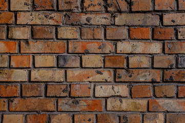 Red brick rustic textured background with a cement in a seams