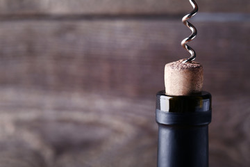 Wine bottle with cork and corkscrew