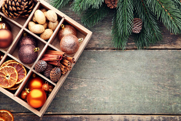 Colourful christmas baubles with dried orange, cones and cinnamon