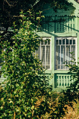 beautiful rustic wooden old building in sunny garden, exploring country, abandoned life, travel concept