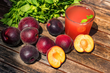 Fresh plum smoothie with plums close