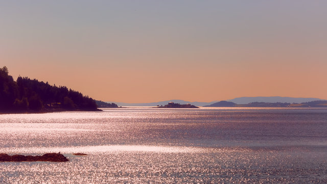 Trondheim fjord and the old abandoned fortress Steinvikholmen during sunset 