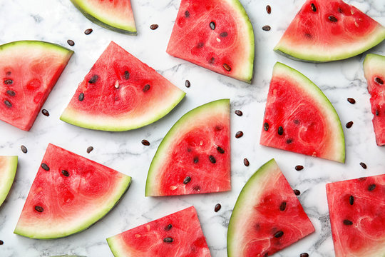 Flat lay composition with watermelon slices on marble background