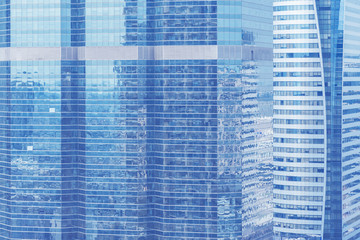 Abstract background from blue glasses window, high modern business building in city. Picture for add text message. Backdrop for design art work.