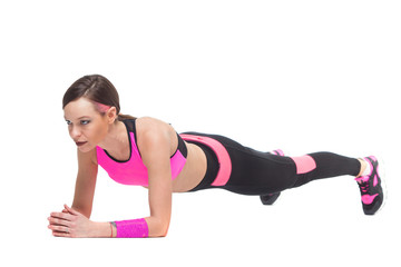 Fototapeta premium one woman exercising workout fitness aerobic exercise on studio isolated white background. Perfect plank.