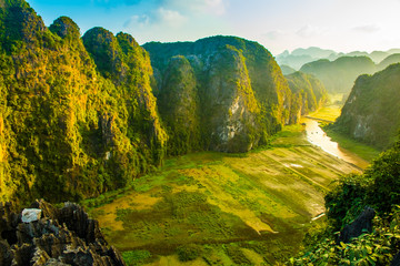 Beautiful sunset landscape viewpoint from the top of Mua Cave mountain, Ninh Binh, Tam Coc in...