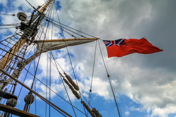 Flag flying from the mast of a tall ship in Gloucester docks england