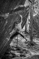 Active lifestyle concept.Young climber man climbing a rock.