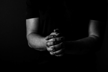 Folded Hands of a man. black and whit. Arms and hands